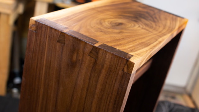 Cherry whiskey cabinet — bookmatched panel backing detail