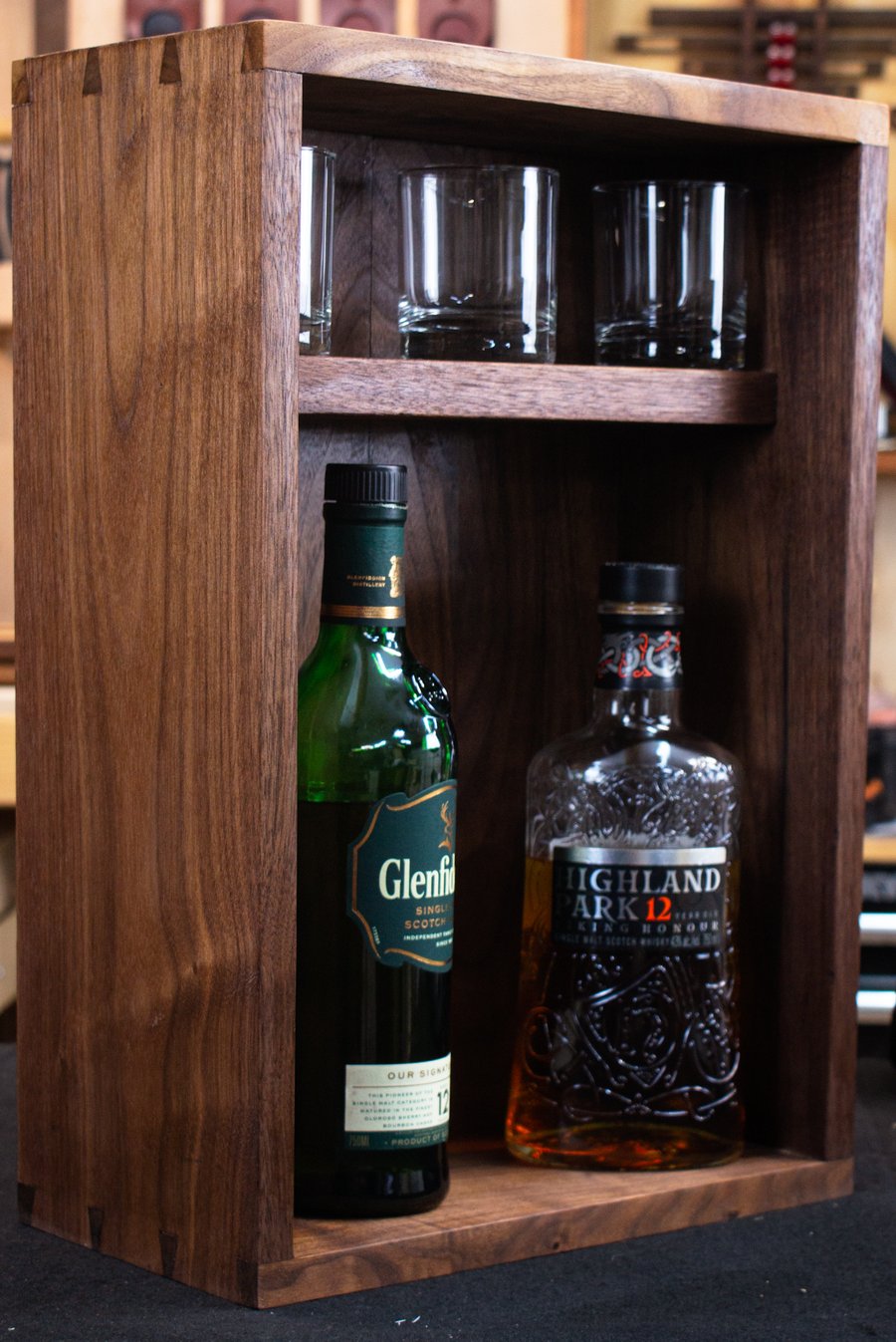 Walnut cabinet — installed and styled with collection