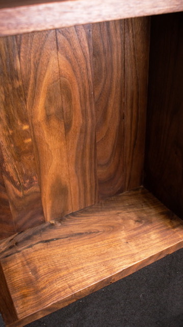 Walnut and steel side table — sculpted top